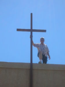 warren-on-roof-with-cross